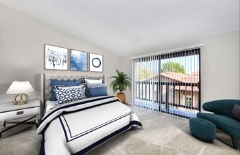 A bedroom with a bed and a window